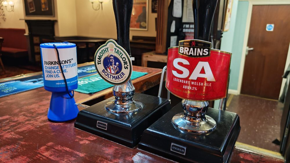Close-up of guest ale hand pumps showing Timothy Taylor's Boltmaker and Brains SA
